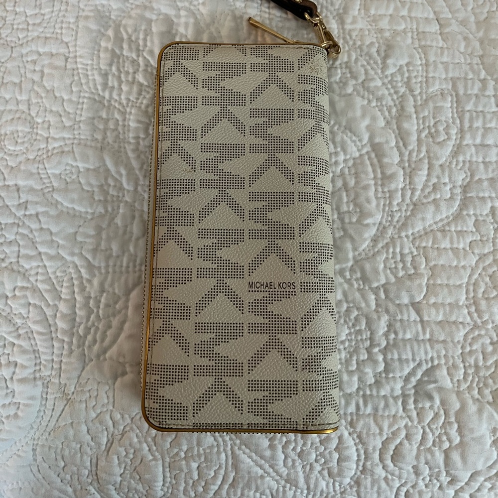 Michael Kors wallet vanilla color with wristlet strap strap